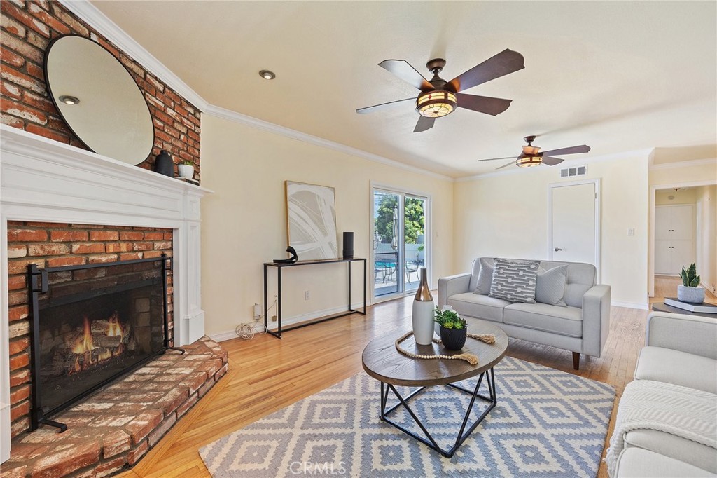 14895 Fairvilla Drive La Mirada, CA 90638 - Photo 5 of 31 a living room with furniture and a fireplace