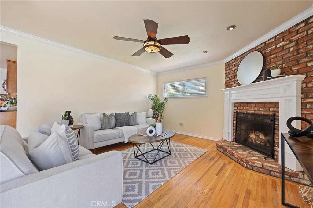 14895 Fairvilla Drive La Mirada, CA 90638 - Photo 6 of 31 a living room with furniture and a fireplace