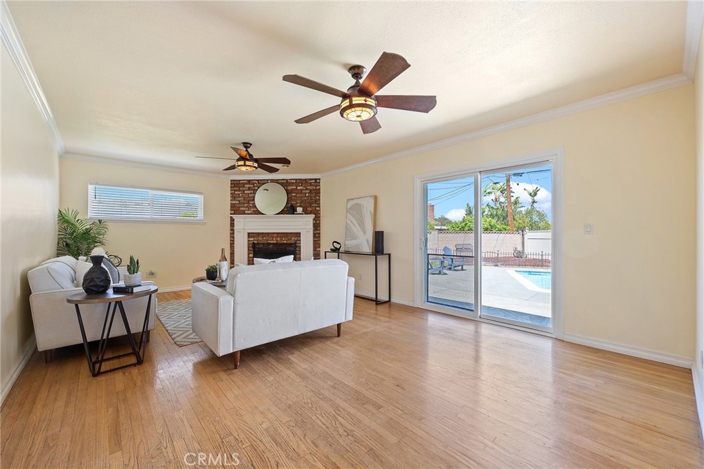 14895 Fairvilla Drive La Mirada, CA 90638 - Photo 7 of 31 a living room with furniture and a chandelier