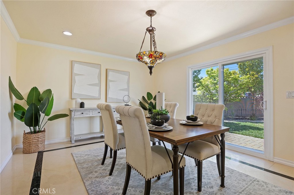 14895 Fairvilla Drive La Mirada, CA 90638 - Photo 8 of 31 a view of a dining room with furniture window and wooden floor