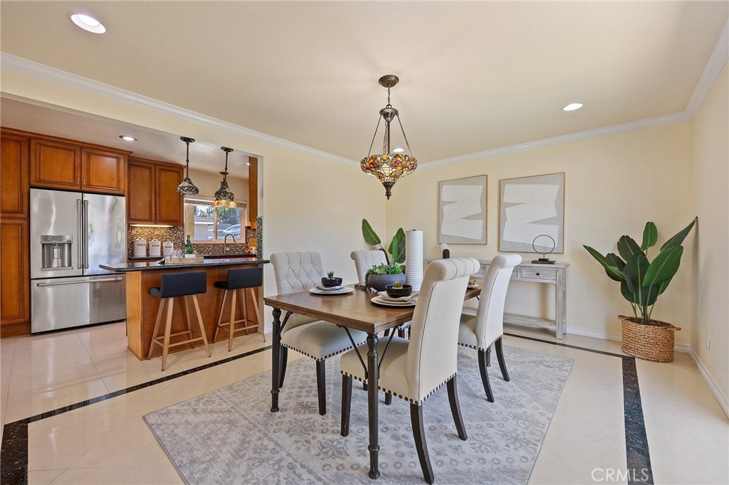 14895 Fairvilla Drive La Mirada, CA 90638 - Photo 9 of 31 a view of a dining room with furniture window and wooden floor