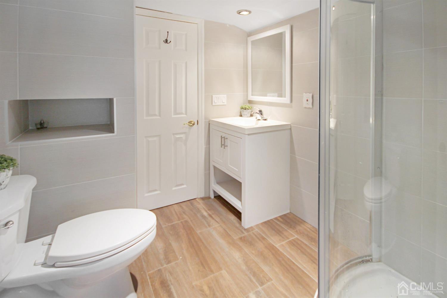 3 Dobson Road Edison, NJ 08817 - Photo 22 of 25 a bathroom with a sink a toilet and shower