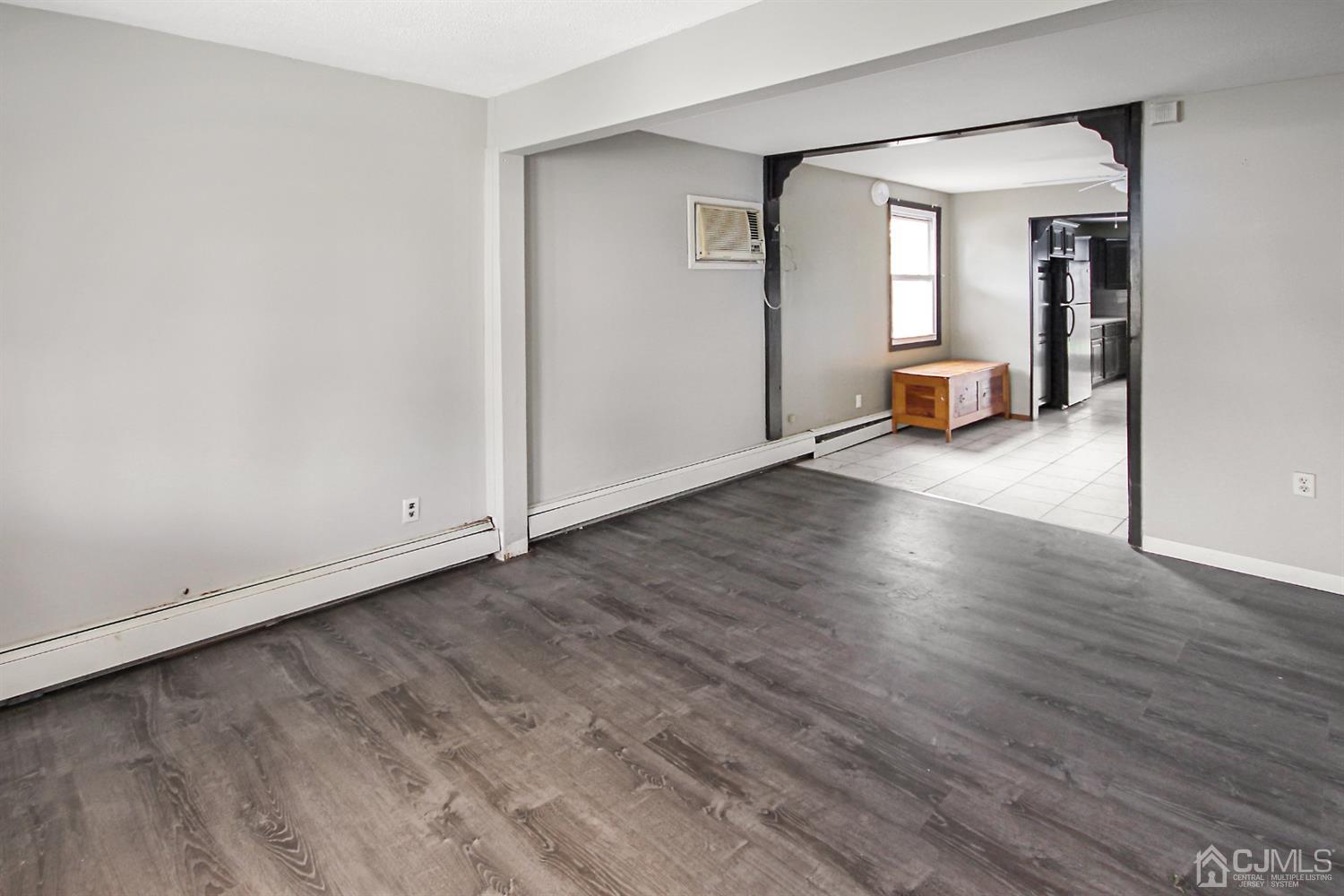 3 Dobson Road Edison, NJ 08817 - Photo 4 of 25 a view of empty room with wooden floor and fan