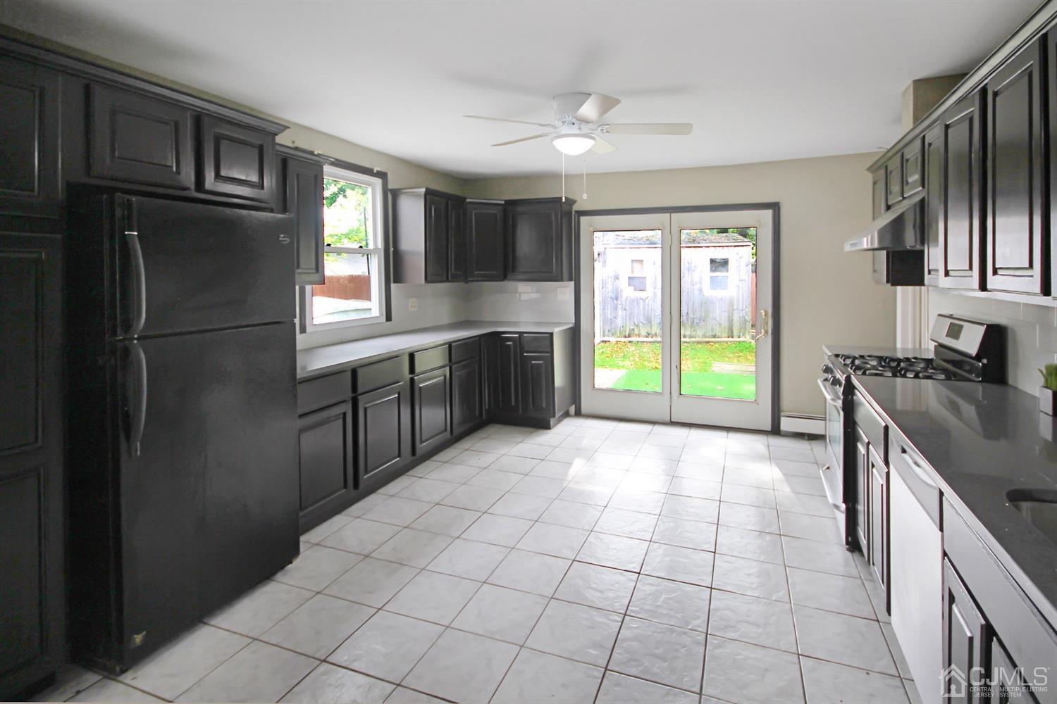 3 Dobson Road Edison, NJ 08817 - Photo 7 of 25 a kitchen with stainless steel appliances granite countertop a refrigerator and a sink
