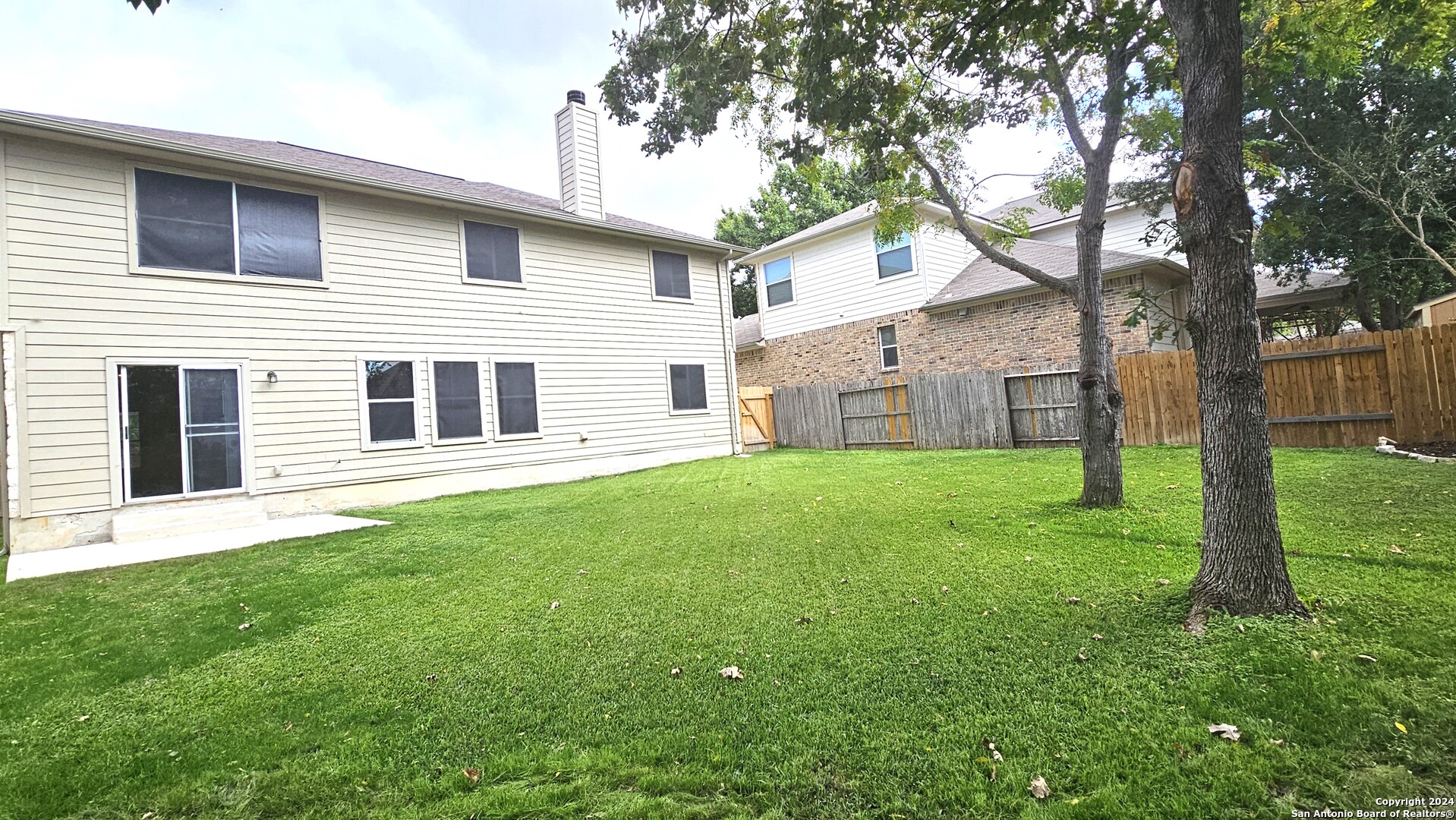 209 Storm Mt Road Cibolo, TX 78108 - Photo 16 of 28 a house that has a big yard