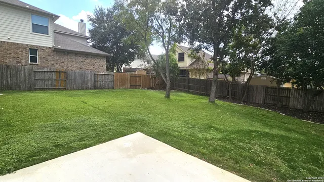 a backyard of a house with lots of green space