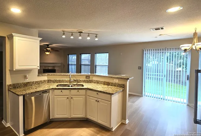 a kitchen that has a lot of cabinets in it