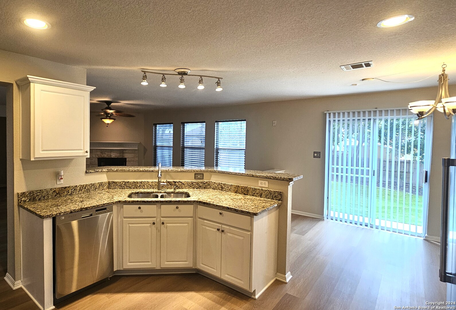209 Storm Mt Road Cibolo, TX 78108 - Photo 2 of 28 a kitchen that has a lot of cabinets in it