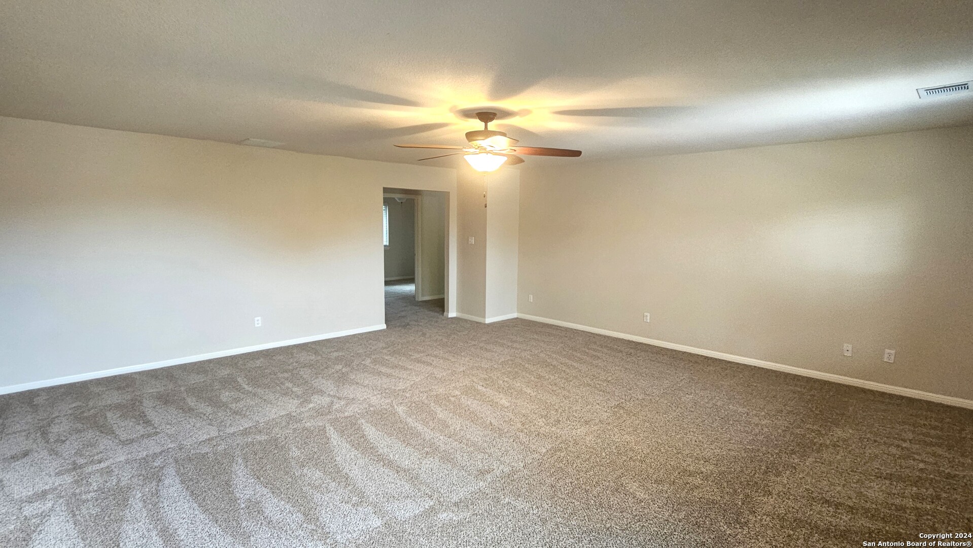 209 Storm Mt Road Cibolo, TX 78108 - Photo 27 of 28 a view of an empty room and a ceiling fan