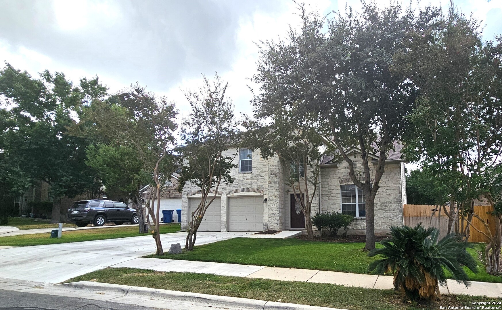 209 Storm Mt Road Cibolo, TX 78108 - Photo 28 of 28 a front view of a house with a yard and trees