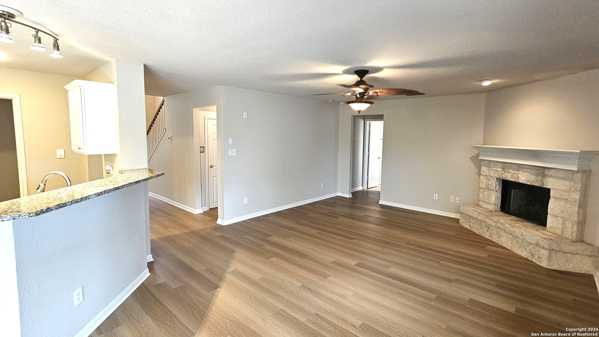 209 Storm Mt Road Cibolo, TX 78108 - Photo 7 of 28 a view of an empty room with window and wooden floor