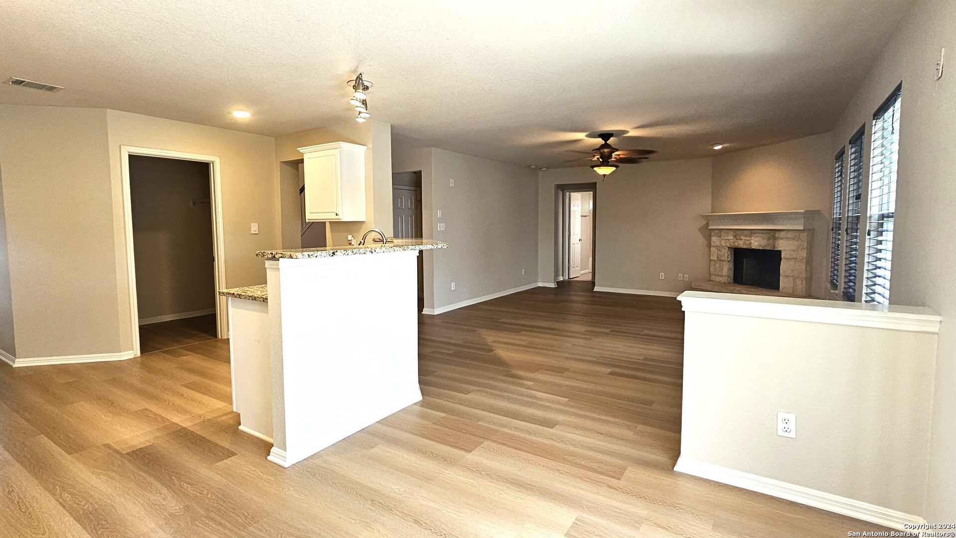 209 Storm Mt Road Cibolo, TX 78108 - Photo 9 of 28 a view of a kitchen with furniture and a ceiling fan