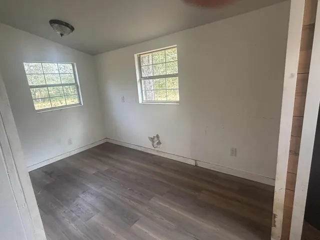 a bath tub sitting in a bathroom next to a toilet