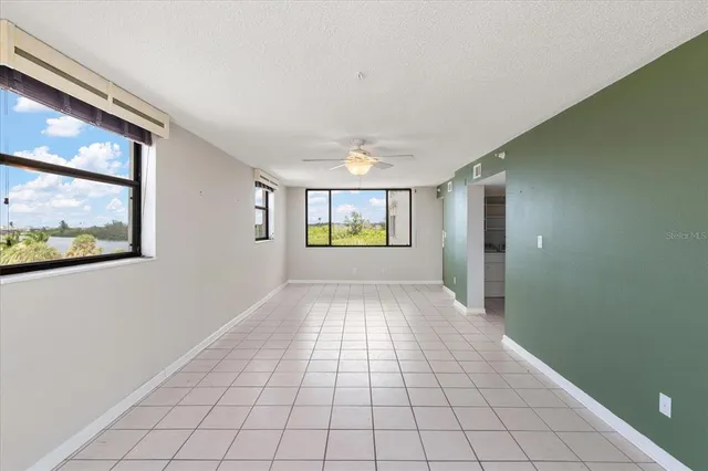 a view of an empty room with a window