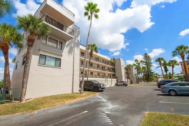 a view of a street that has couple of cars parked on the road