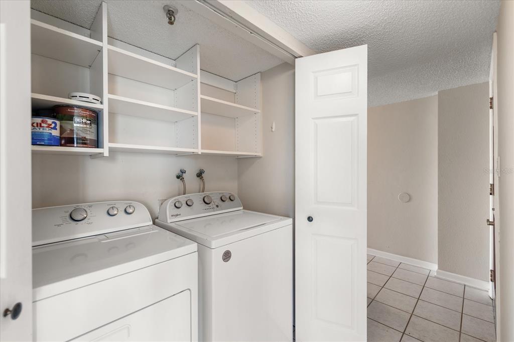 18201 Gulf Boulevard, Unit 401 Redington Shores, FL 33708 - Photo 21 of 42 a utility room with dryer and washer