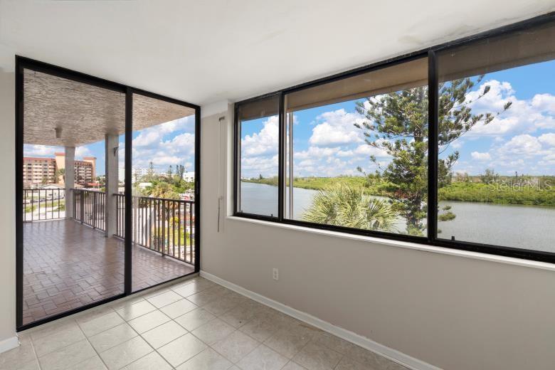 18201 Gulf Boulevard, Unit 401 Redington Shores, FL 33708 - Photo 23 of 42 a view of a large window with an outdoor space