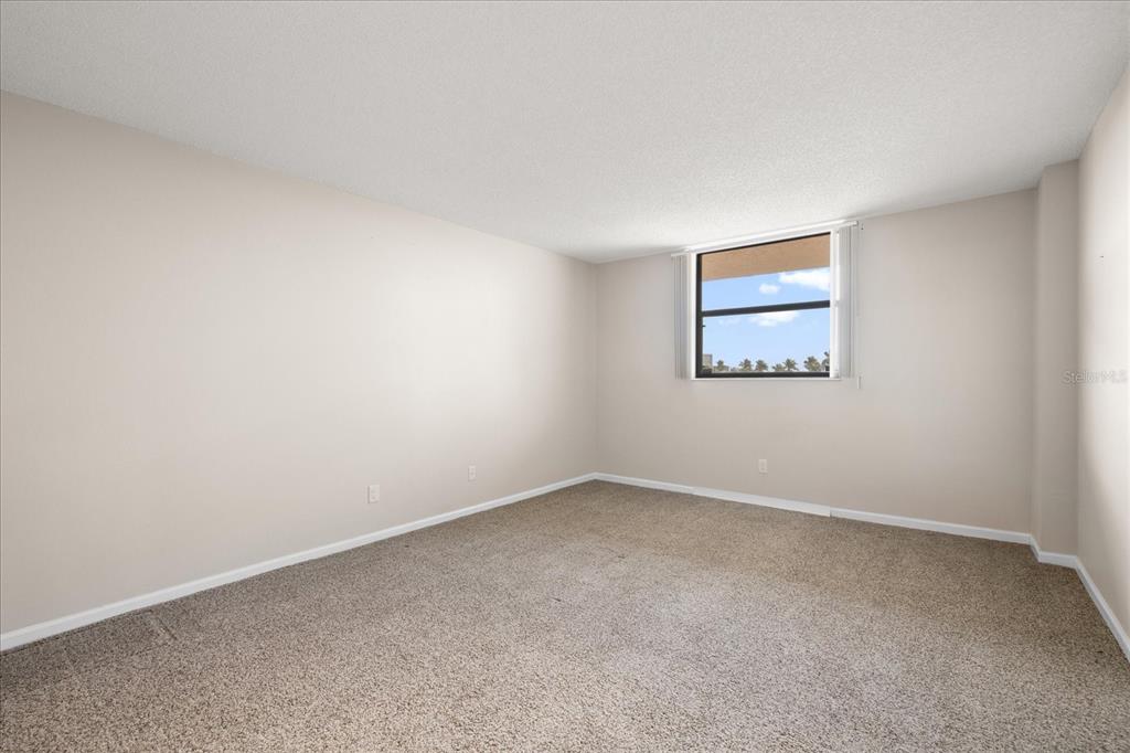 18201 Gulf Boulevard, Unit 401 Redington Shores, FL 33708 - Photo 28 of 42 a view of an empty room with a window