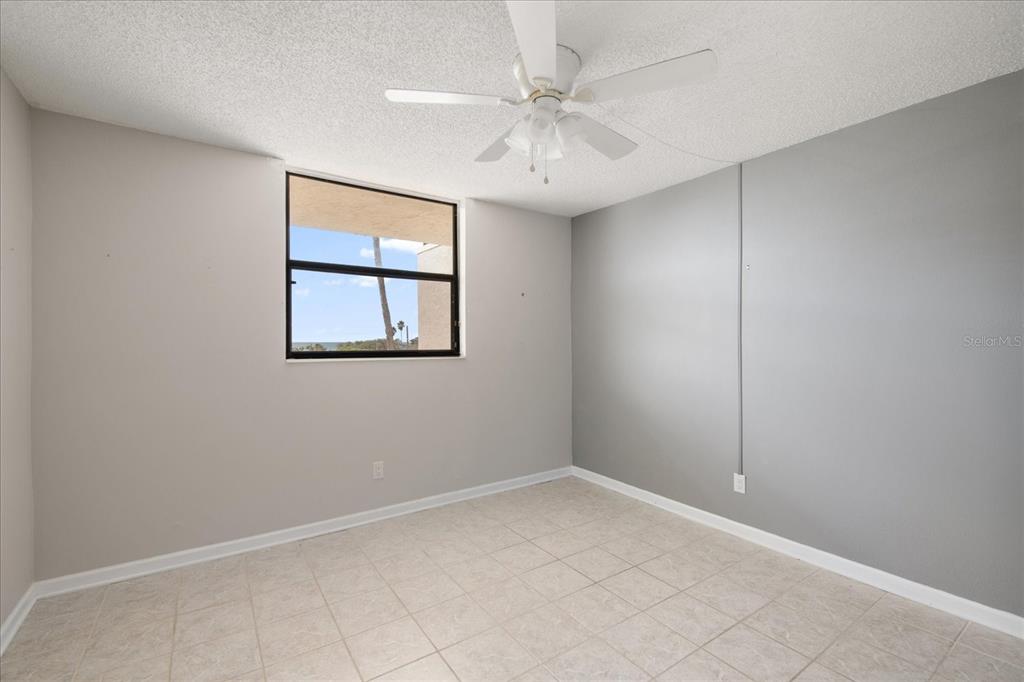 18201 Gulf Boulevard, Unit 401 Redington Shores, FL 33708 - Photo 31 of 42 an empty room with a window