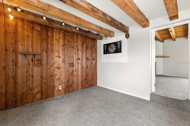 a view of an empty room with a fireplace