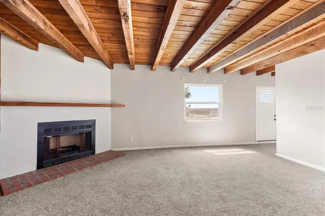 a bathroom with a granite countertop sink a toilet and bathtub