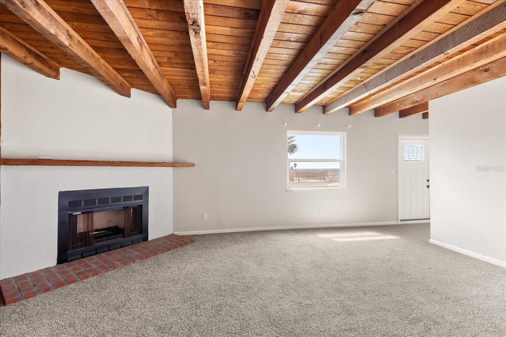 18201 Gulf Boulevard, Unit 401 Redington Shores, FL 33708 - Photo 34 of 42 a view of an empty room with a fireplace