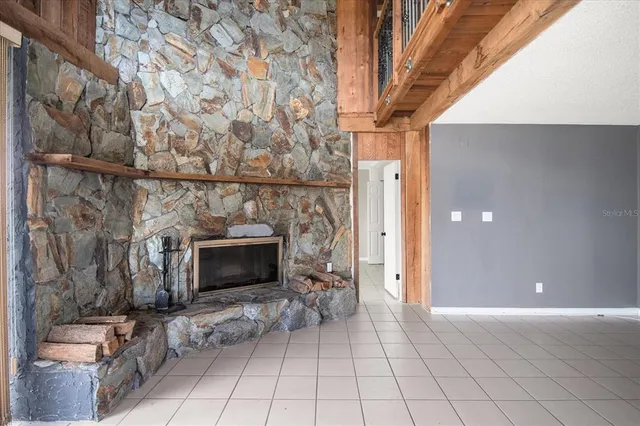 a view of a livingroom with furniture and a fireplace