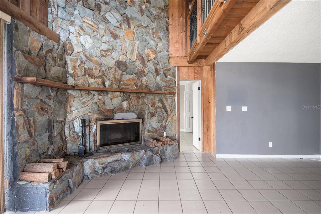18201 Gulf Boulevard, Unit 401 Redington Shores, FL 33708 - Photo 4 of 42 a view of a livingroom with furniture and a fireplace