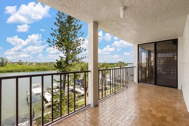 a kitchen with stainless steel appliances granite countertop a sink and a microwave