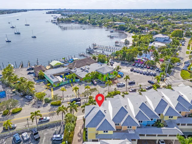 an aerial view of residential houses with outdoor space