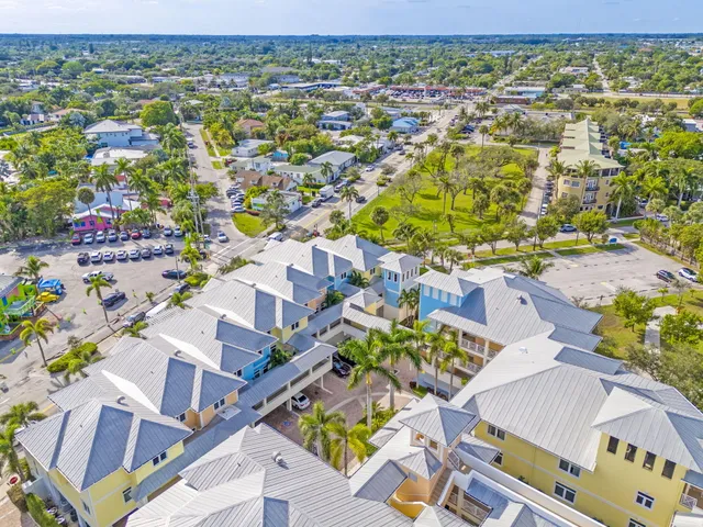 an aerial view of a houses with outdoor space