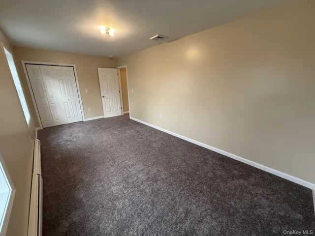 an empty room with a bathroom