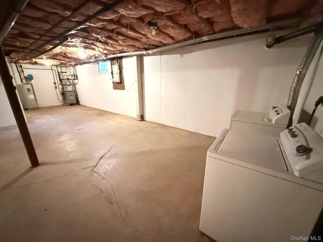 a view of empty room with wooden walls