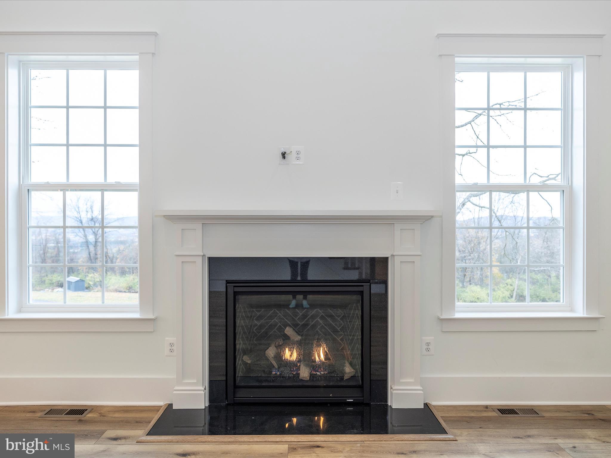 7022 Ridge Road Frederick, MD 21702 - Photo 11 of 63 a living room with a fireplace with a window