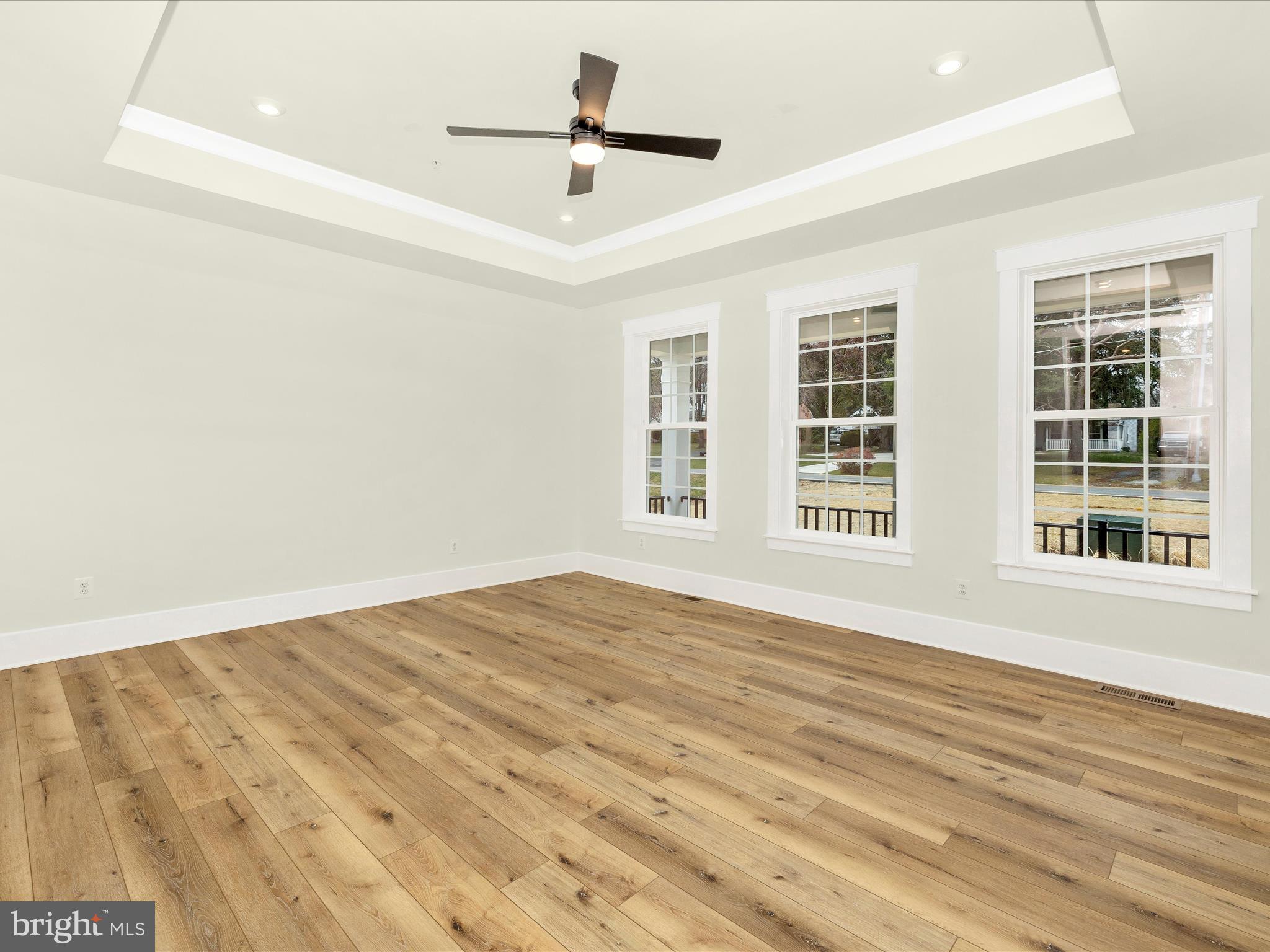 7022 Ridge Road Frederick, MD 21702 - Photo 32 of 63 a view of an empty room with a window and wooden floor