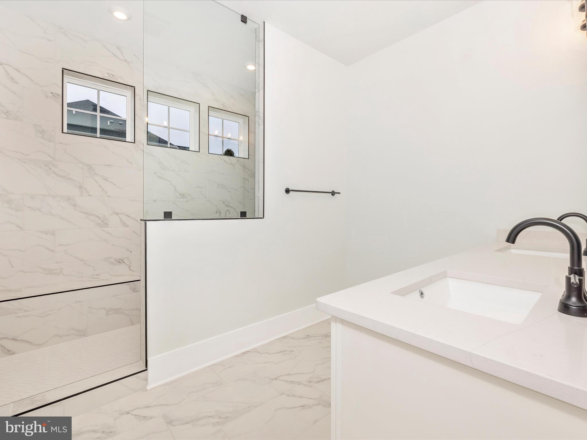 7022 Ridge Road Frederick, MD 21702 - Photo 38 of 63 a bathroom with a sink and mirror