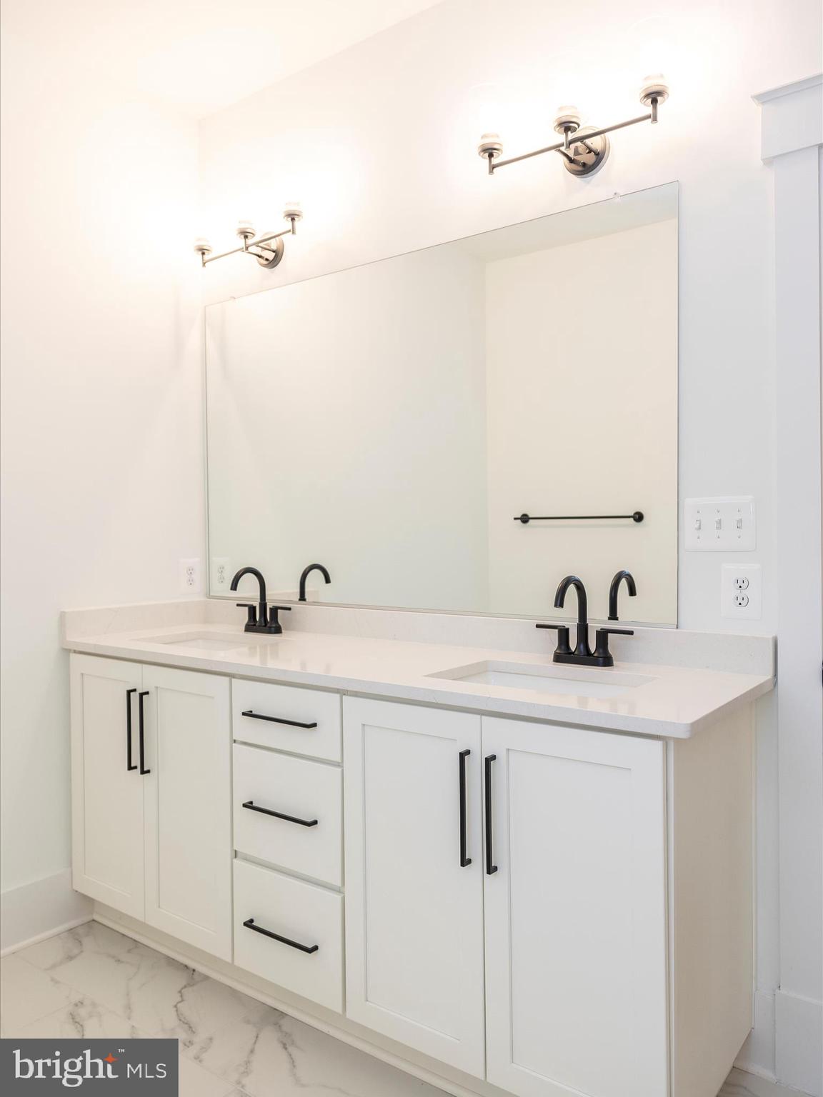 7022 Ridge Road Frederick, MD 21702 - Photo 39 of 63 a bathroom with a sink and a mirror