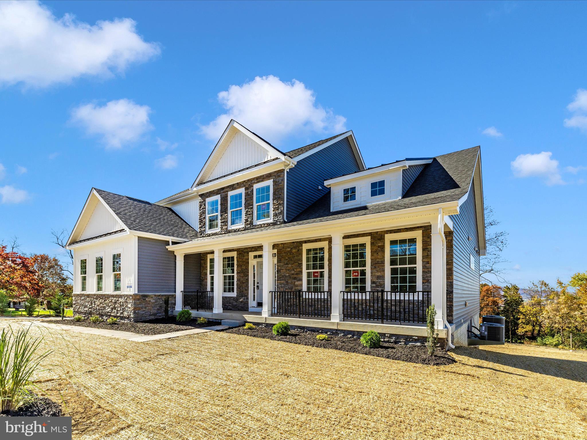 7022 Ridge Road Frederick, MD 21702 - Photo 4 of 63 front view of a house with a yard