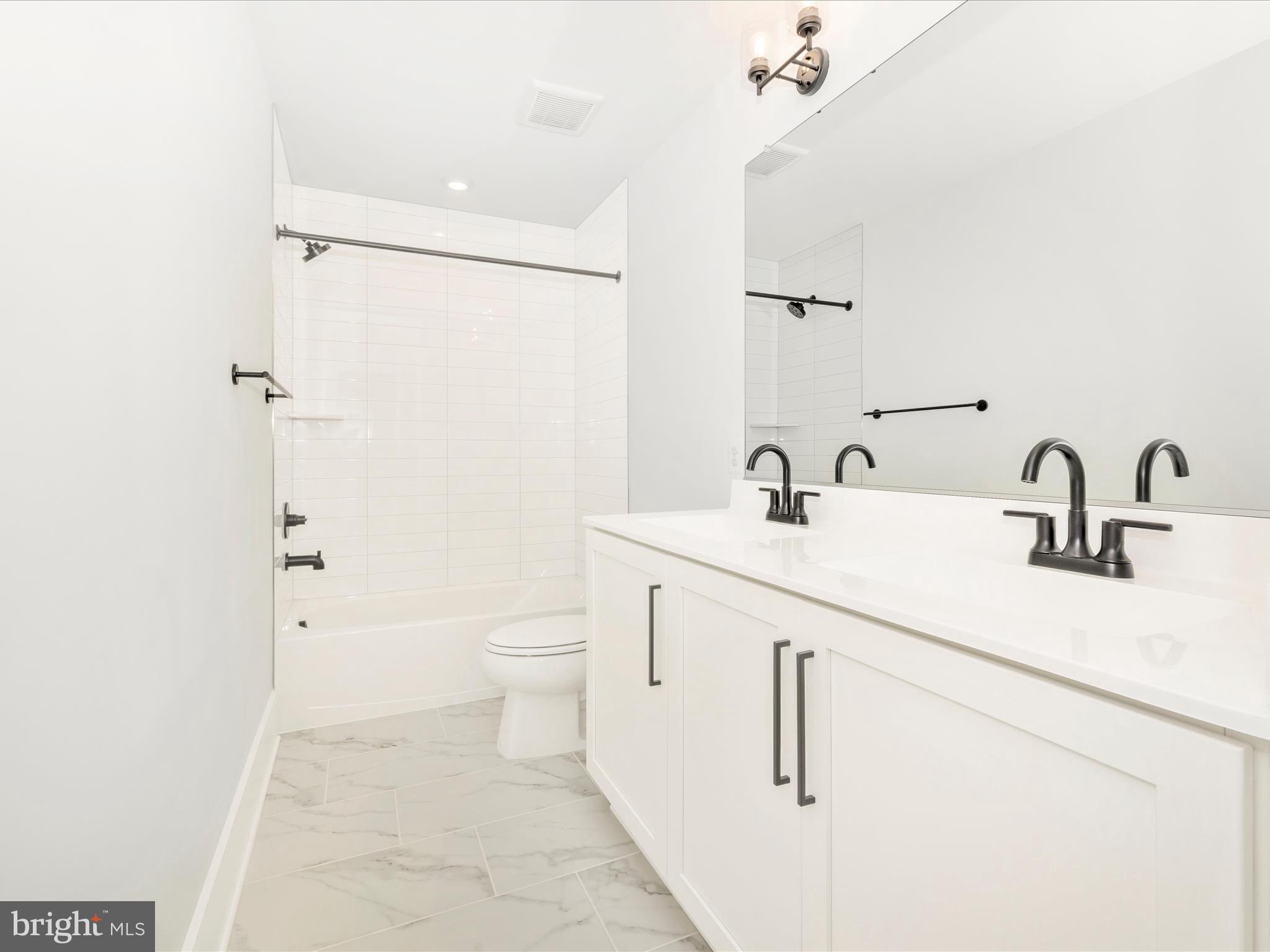 7022 Ridge Road Frederick, MD 21702 - Photo 47 of 63 a bathroom with a sink a toilet and shower