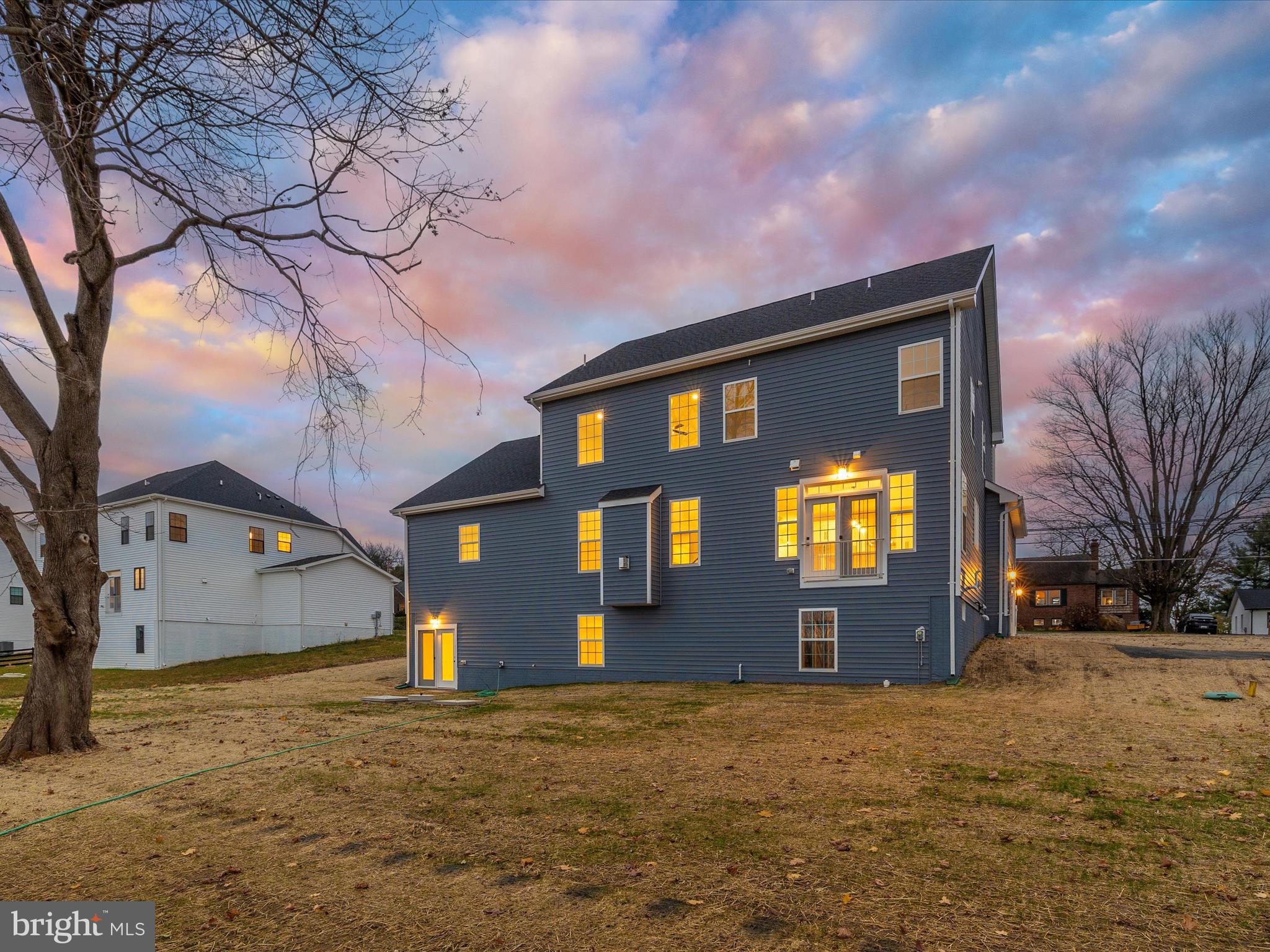 7022 Ridge Road Frederick, MD 21702 - Photo 60 of 63 a front view of a house with a yard and garage