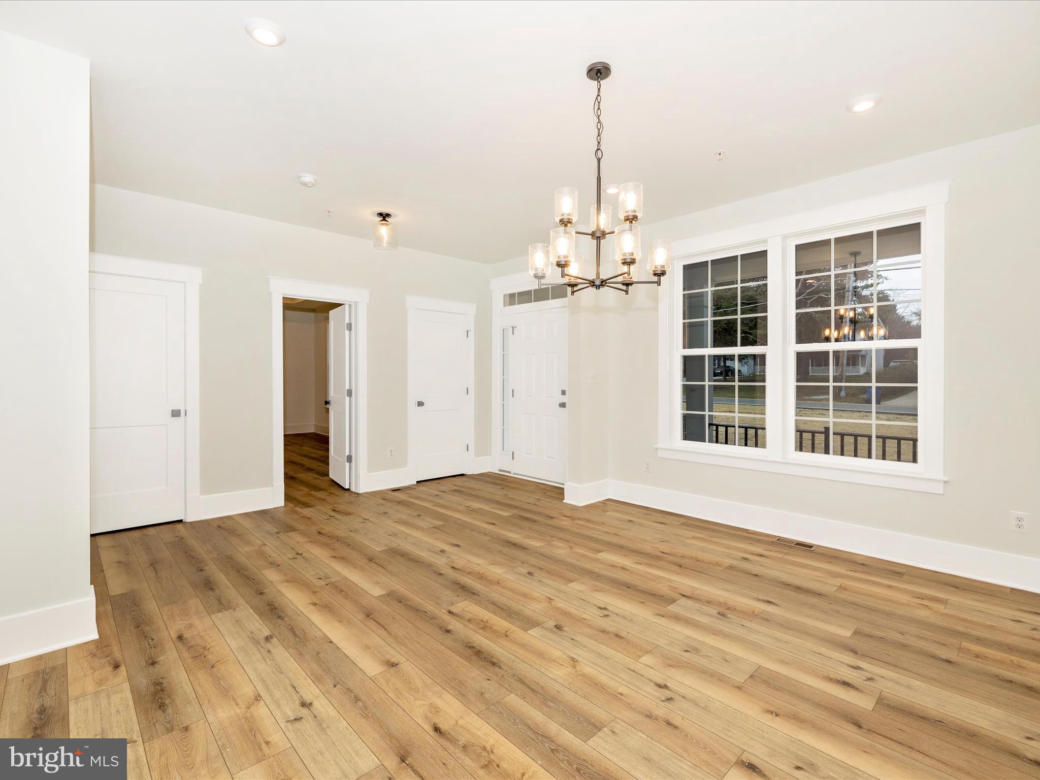 7022 Ridge Road Frederick, MD 21702 - Photo 8 of 63 a view of empty room with wooden floor