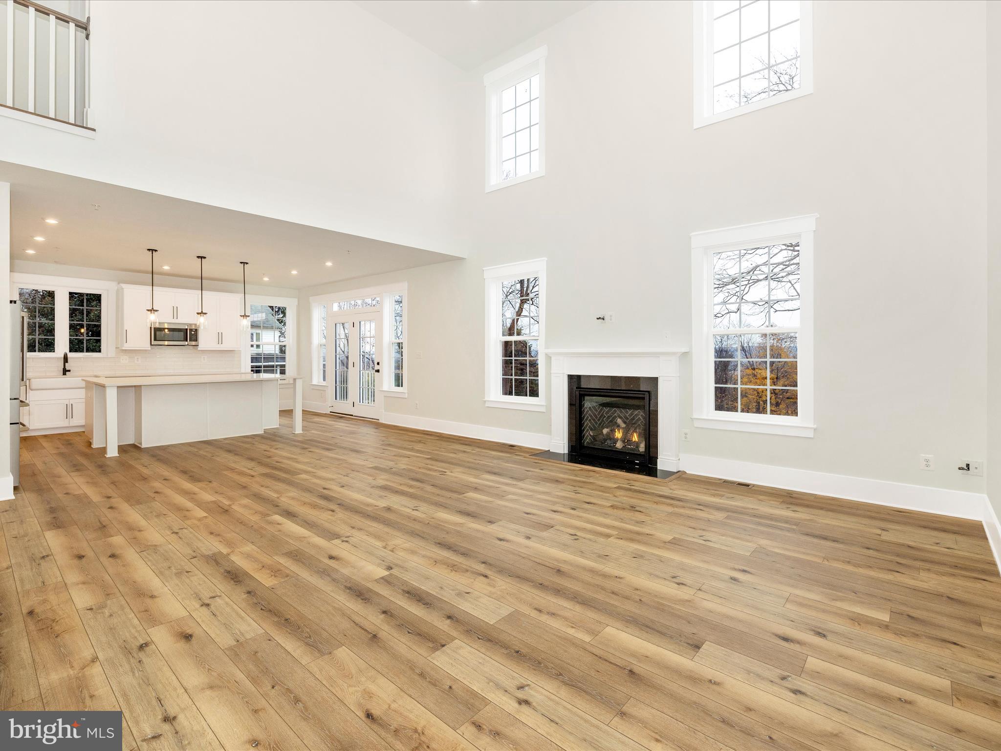 7022 Ridge Road Frederick, MD 21702 - Photo 10 of 63 a view of an empty room with a fireplace and a window