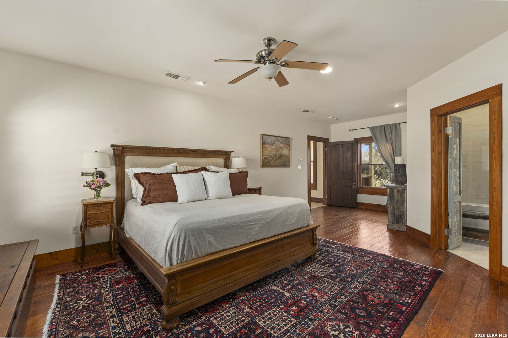 107 High Street Comfort, TX 78013 - Photo 25 of 50 a bed room with a bed and a lamp