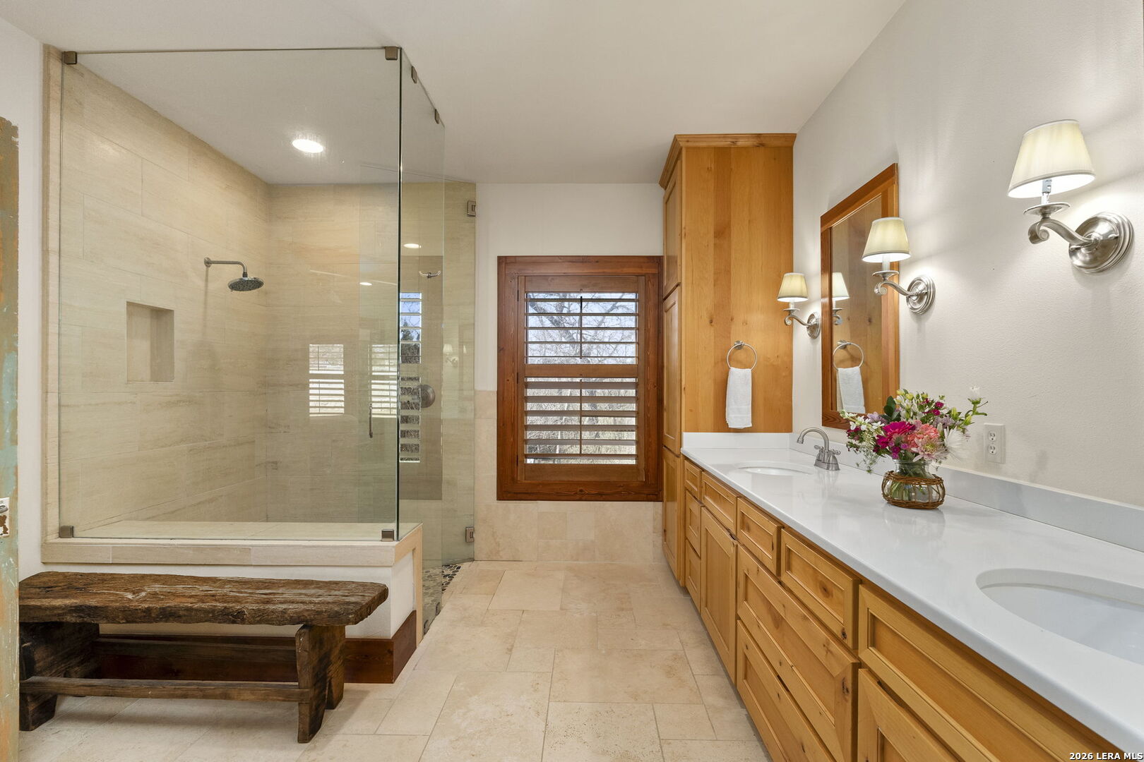 107 High Street Comfort, TX 78013 - Photo 27 of 50 a bathroom with a double vanity sink a toilet a mirror and shower