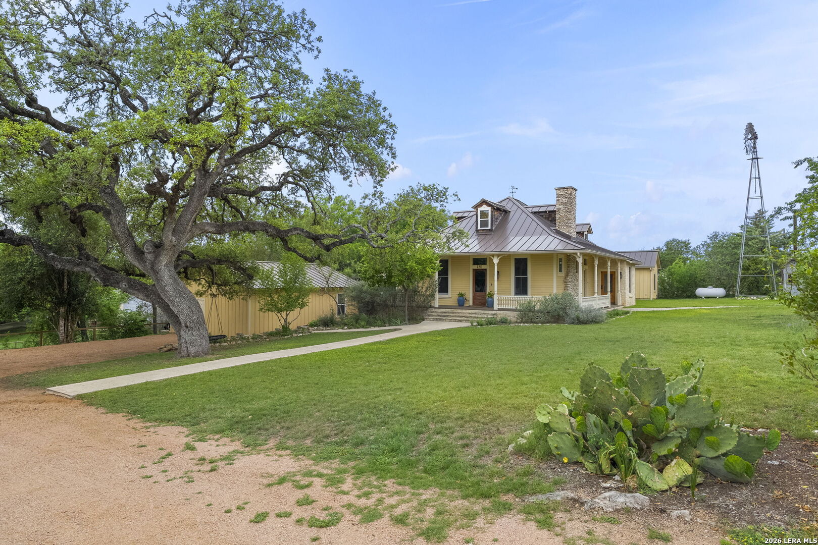 107 High Street Comfort, TX 78013 - Photo 3 of 50 a front view of a house with garden