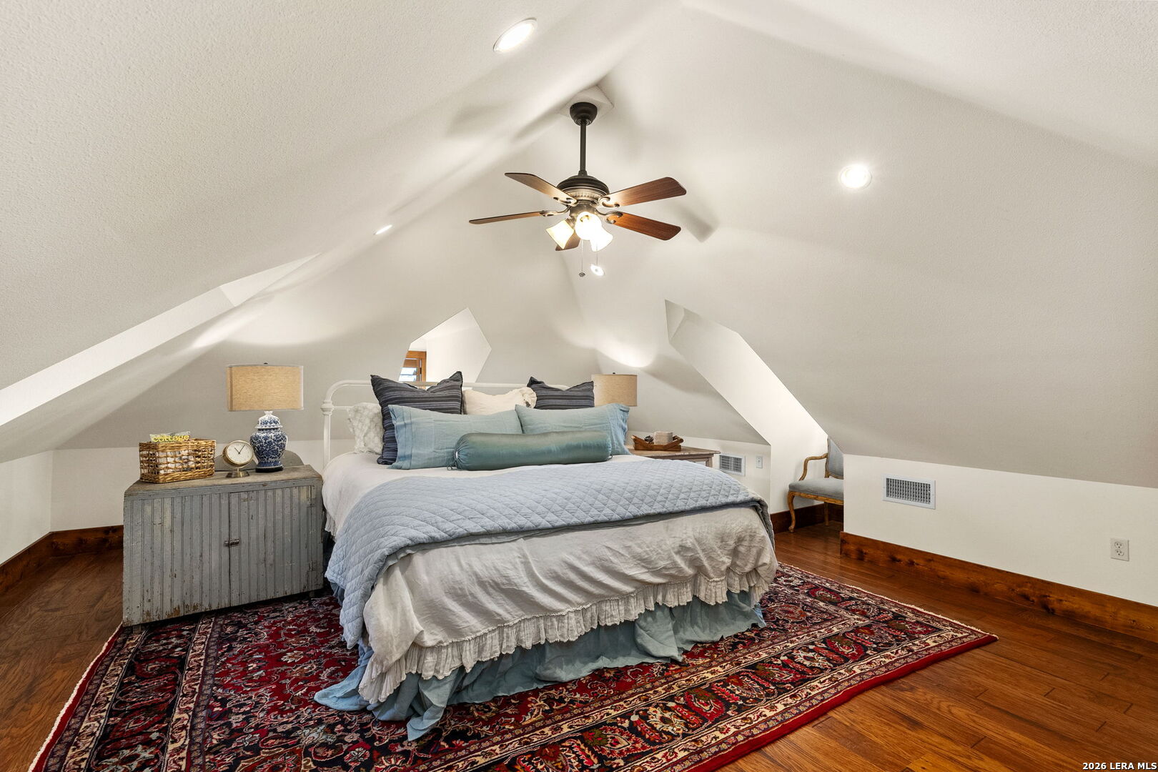 107 High Street Comfort, TX 78013 - Photo 34 of 50 a bedroom with bed and a chandelier