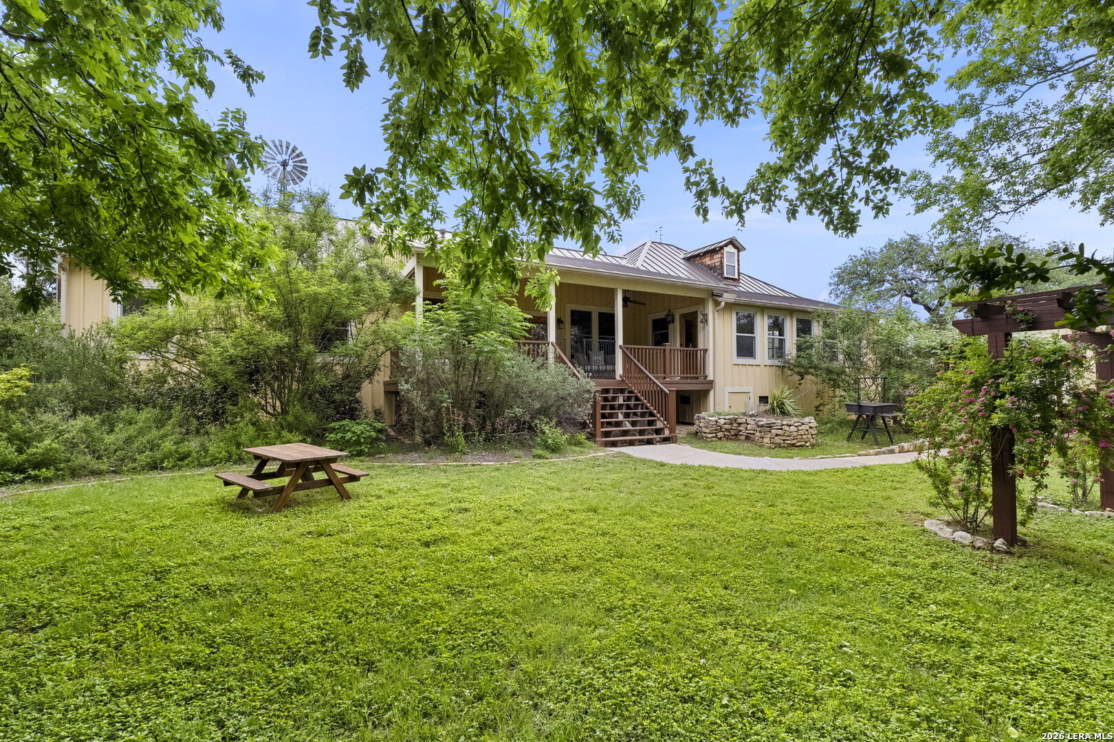 107 High Street Comfort, TX 78013 - Photo 39 of 50 a front view of a house with a garden