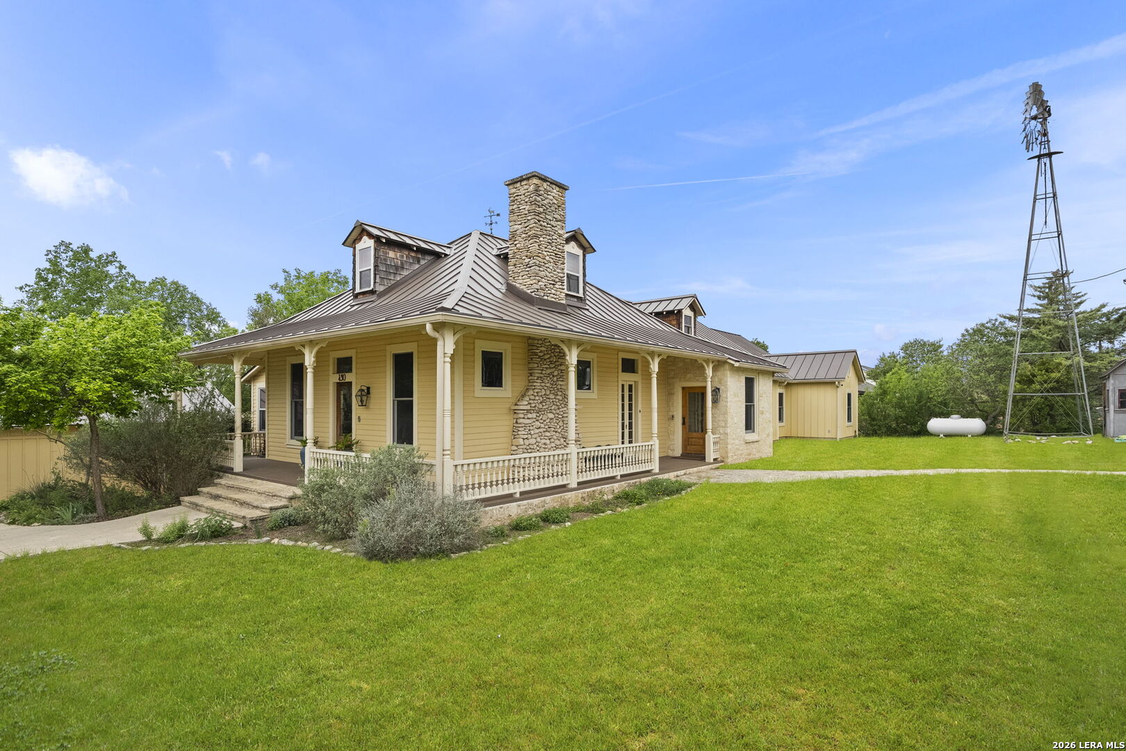 107 High Street Comfort, TX 78013 - Photo 4 of 50 a front view of a house with a yard