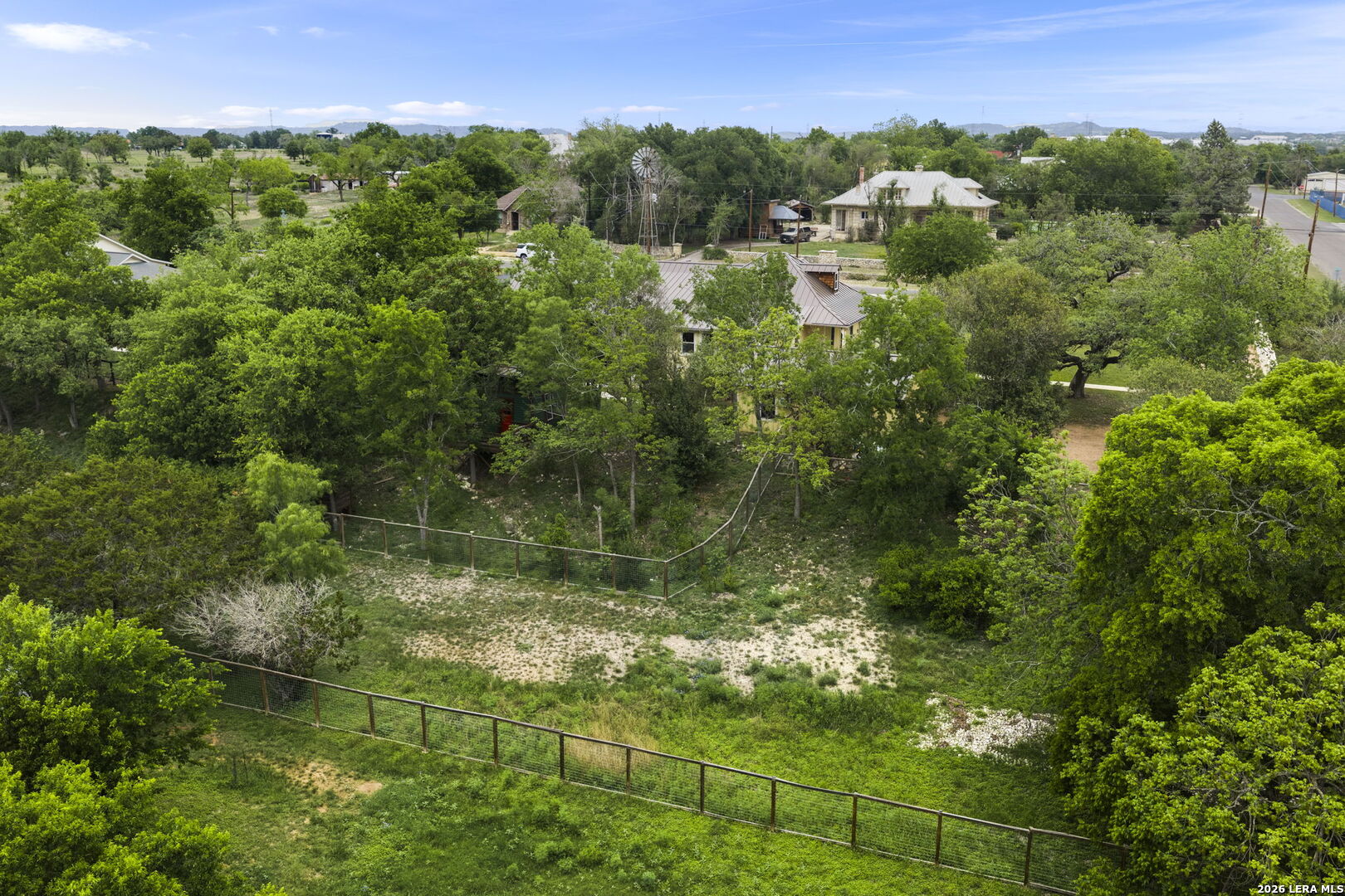 107 High Street Comfort, TX 78013 - Photo 45 of 50 a view of a garden with a lake