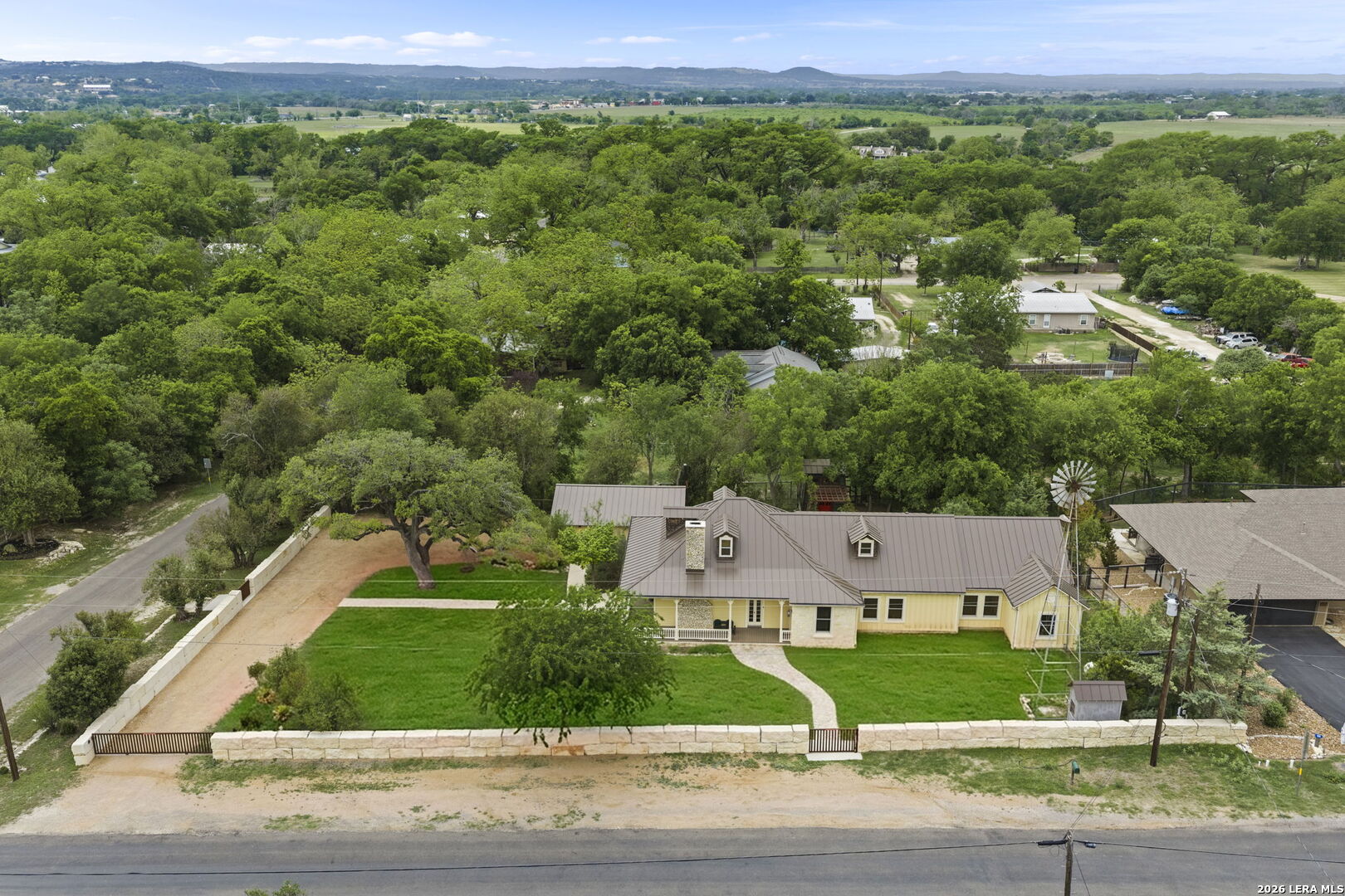 107 High Street Comfort, TX 78013 - Photo 48 of 50 an aerial view of a house with a yard